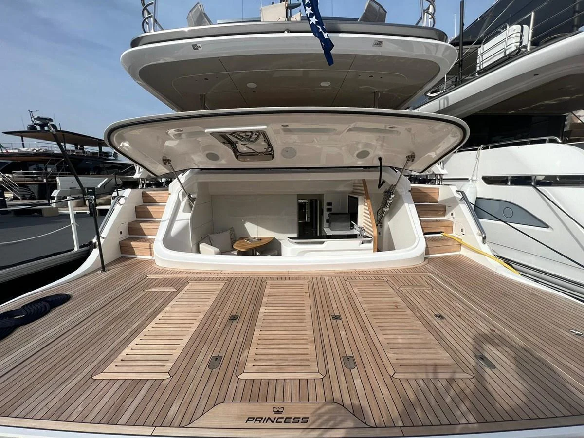 The yacht's aft deck features a spacious teak platform with access to interior amenities. aboard LEILANI Yacht for Sale