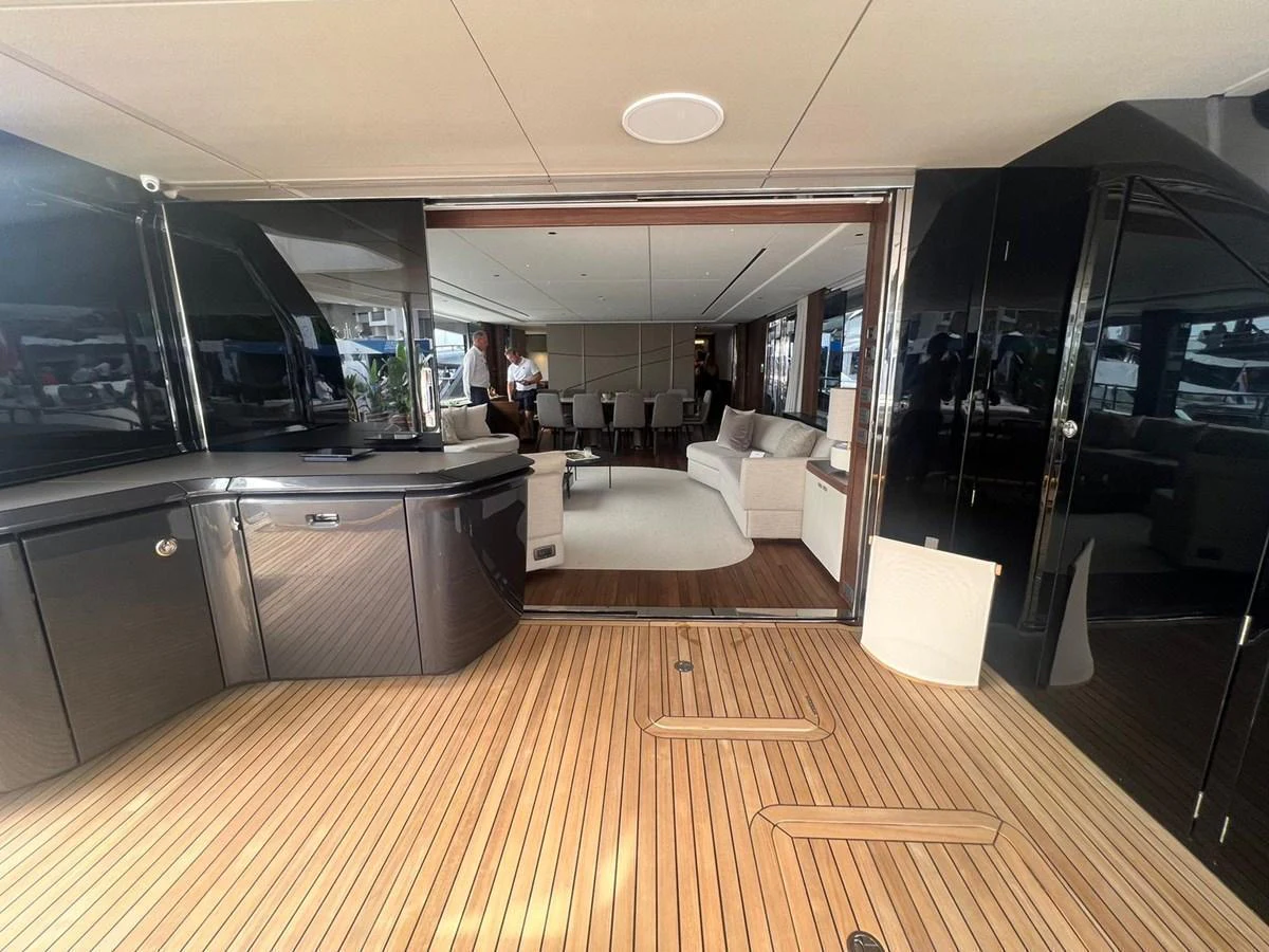 The image showcases a luxurious salon with elegant furnishings and a spacious layout. aboard LEILANI Yacht for Sale