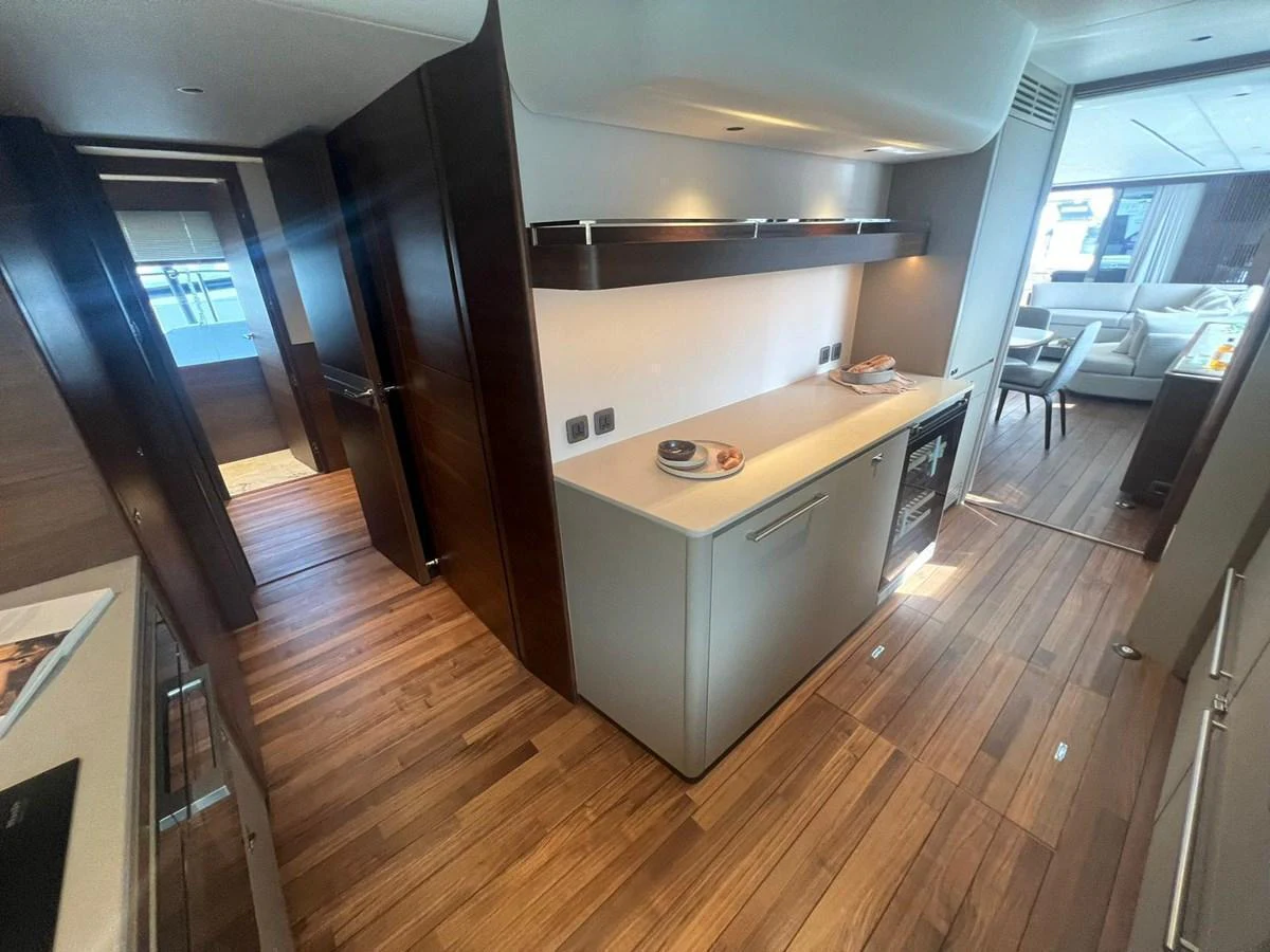 The yacht's galley features modern appliances and sleek cabinetry, seamlessly blending functionality with style. aboard LEILANI Yacht for Sale