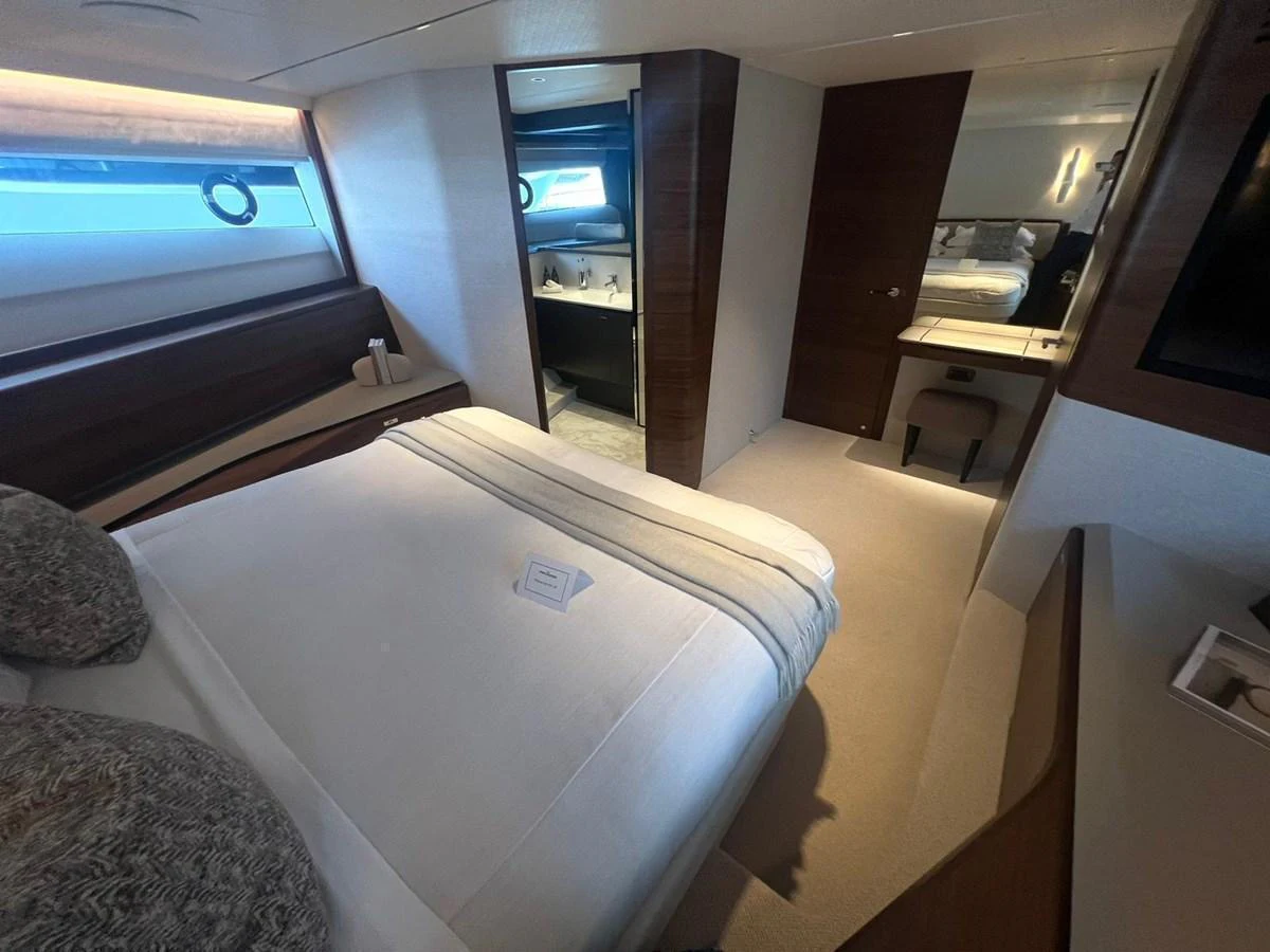 A cozy stateroom with a comfortable bed and modern furnishings. aboard LEILANI Yacht for Sale