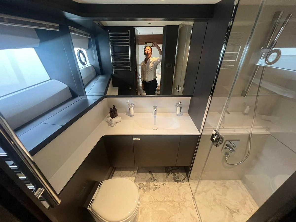 The yacht's bathroom features modern fixtures and a sleek design. aboard LEILANI Yacht for Sale