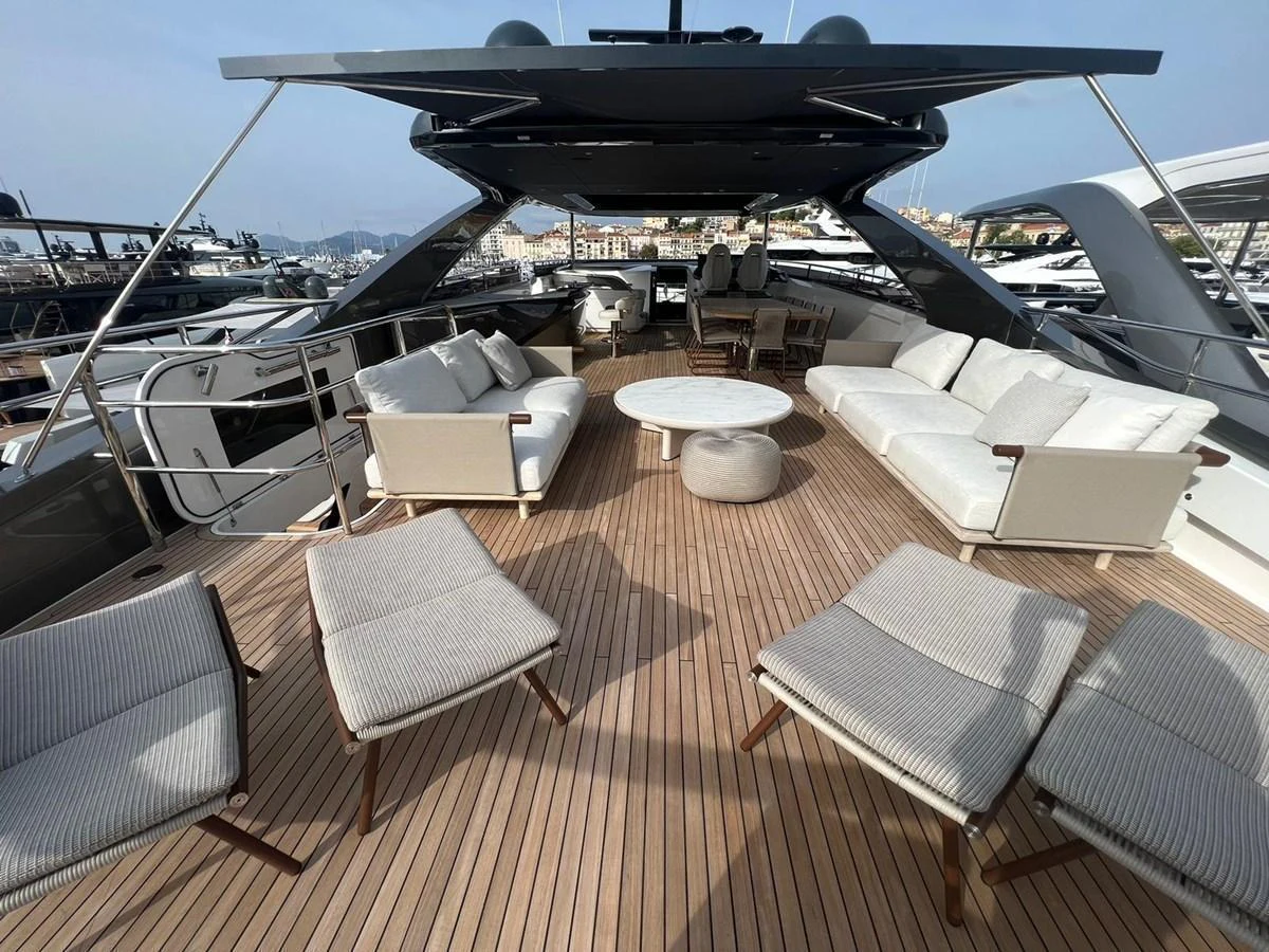 The spacious flybridge features comfortable seating and lounging areas with a stylish, modern design. aboard LEILANI Yacht for Sale