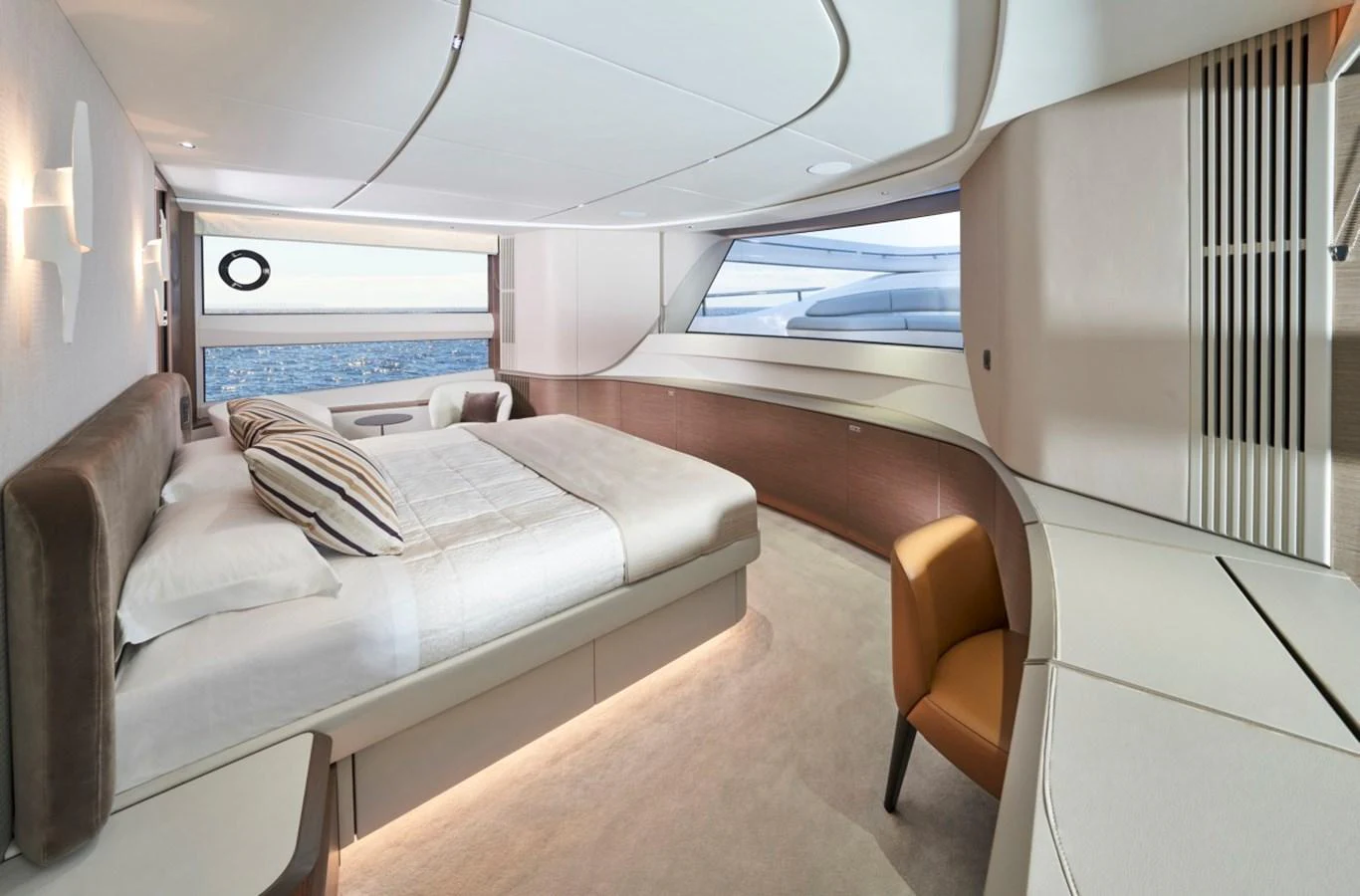 A luxurious stateroom featuring a large bed, modern furnishings, and an ocean view. aboard OCEAN THREE Yacht for Sale