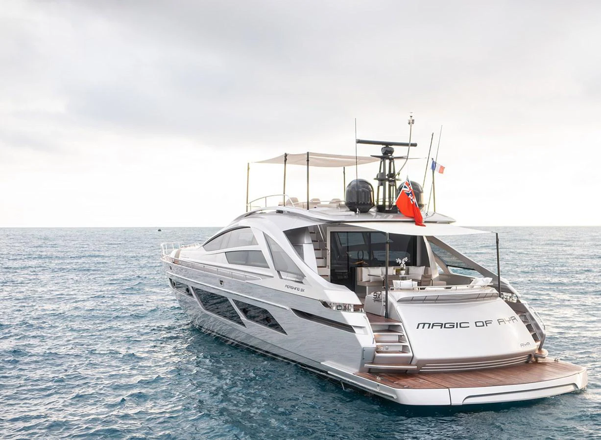 A sleek and modern yacht with an inviting aft deck cruising on calm waters. aboard MAGIC OF AYR Yacht for Sale