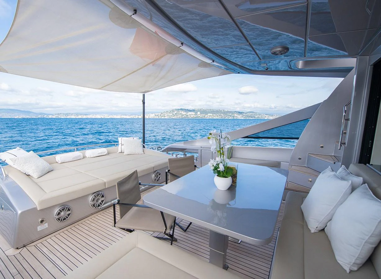 The aft deck offers a luxurious outdoor dining and lounging area with stunning sea views. aboard MAGIC OF AYR Yacht for Sale