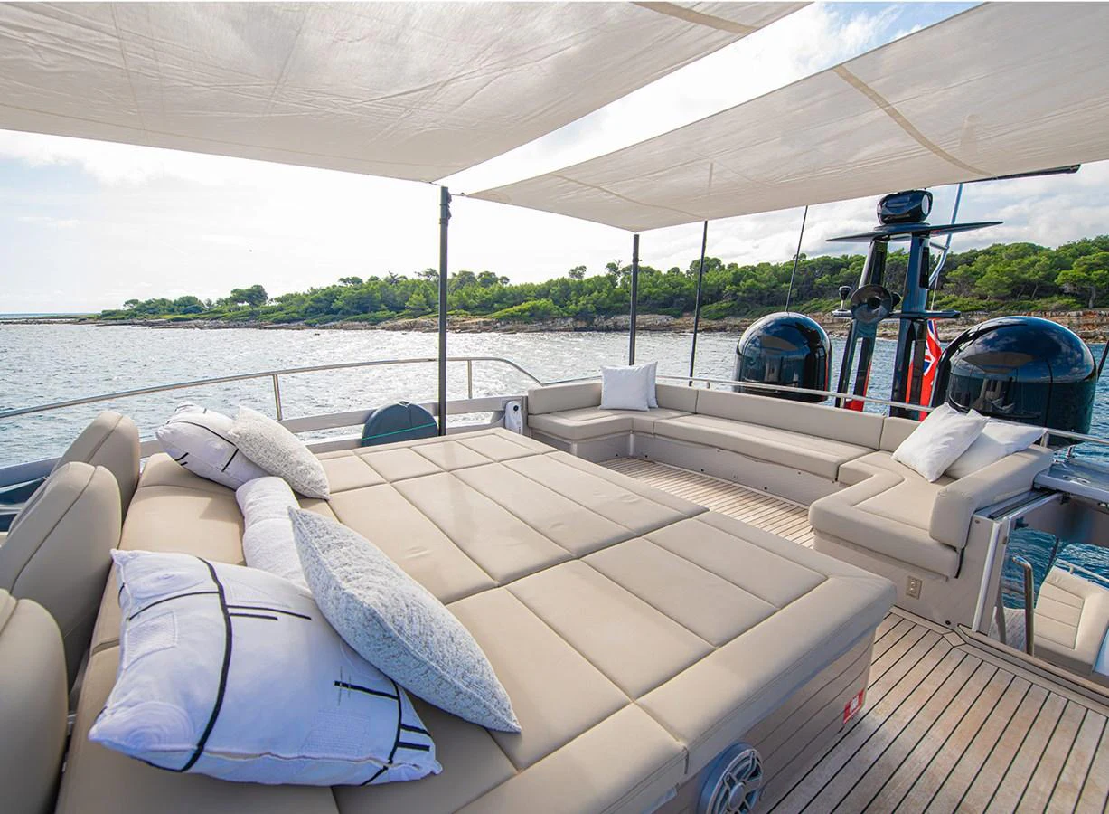 The sundeck offers a spacious lounging area with comfortable seating and scenic views. aboard MAGIC OF AYR Yacht for Sale