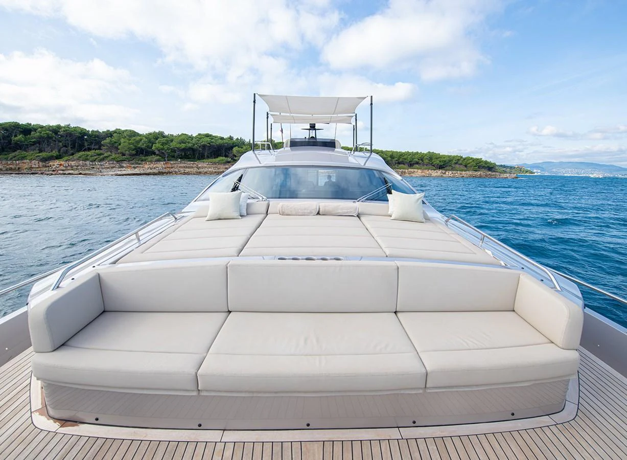 The yacht's spacious foredeck features a large, comfortable sunbathing area with plush cushions, perfect for relaxation. aboard MAGIC OF AYR Yacht for Sale