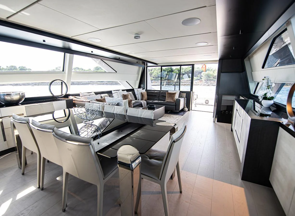 The yacht's salon features a spacious and modern design with ample seating and dining areas. aboard MAGIC OF AYR Yacht for Sale