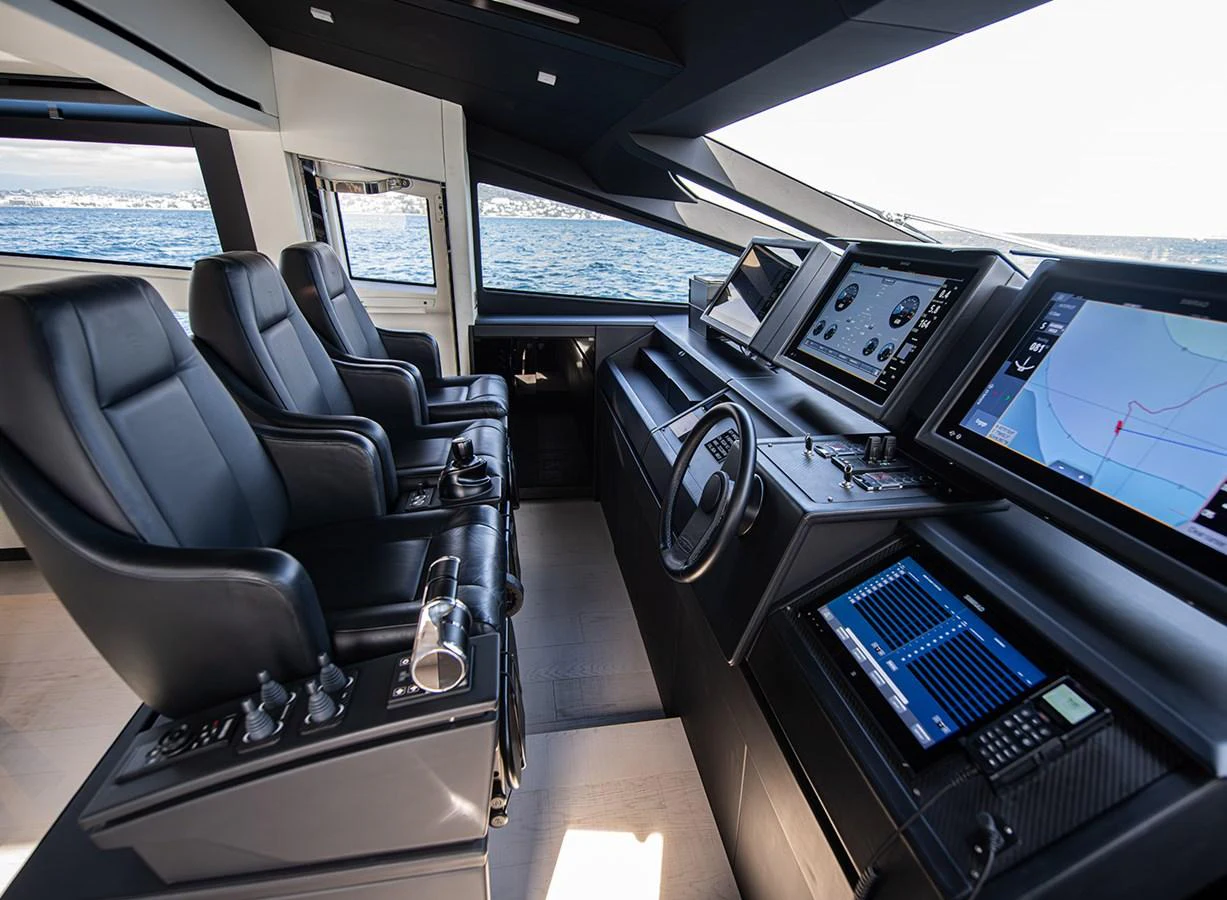 The helm station features state-of-the-art navigation equipment and luxurious seating with a panoramic view. aboard MAGIC OF AYR Yacht for Sale