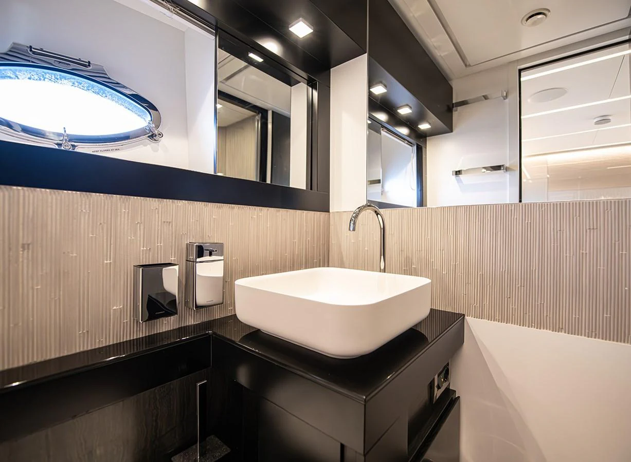 A modern yacht bathroom featuring sleek fixtures and contemporary design. aboard MAGIC OF AYR Yacht for Sale