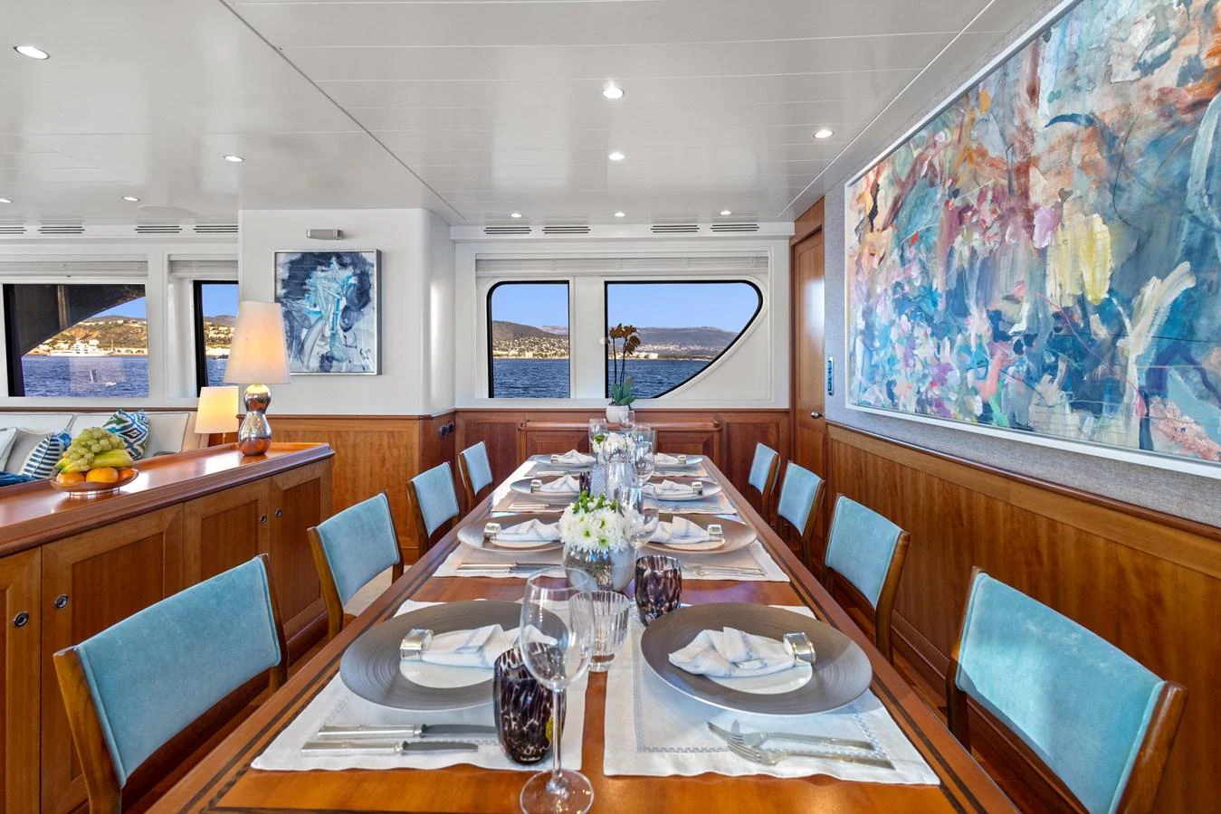 a dining room with a table set aboard ARCHIPELAGO Yacht for Sale