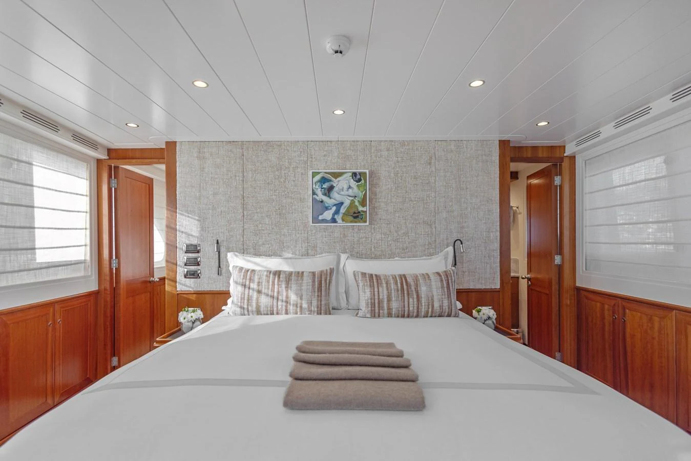a large bed in a room aboard ARCHIPELAGO Yacht for Sale