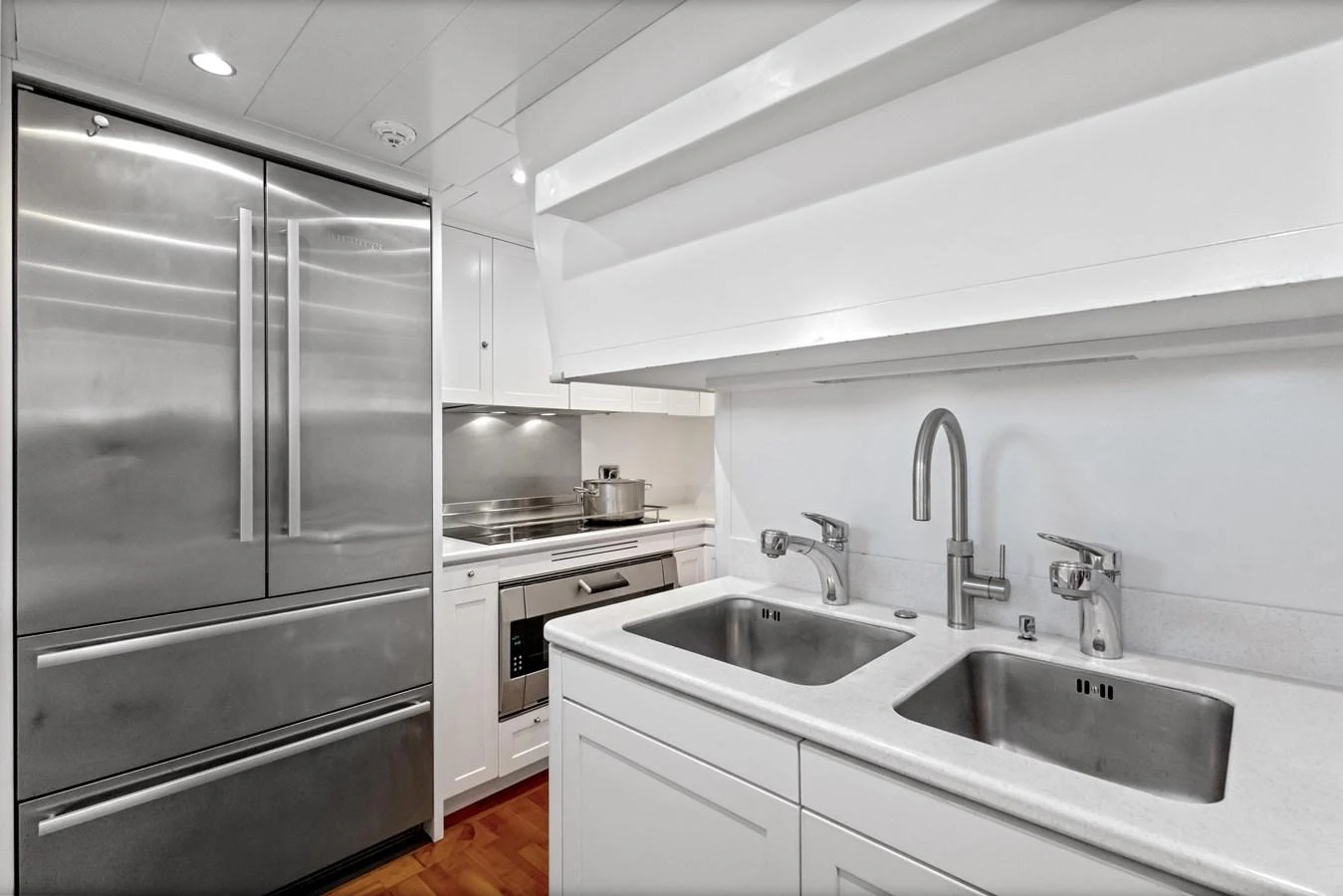 a kitchen with stainless steel appliances aboard ARCHIPELAGO Yacht for Sale