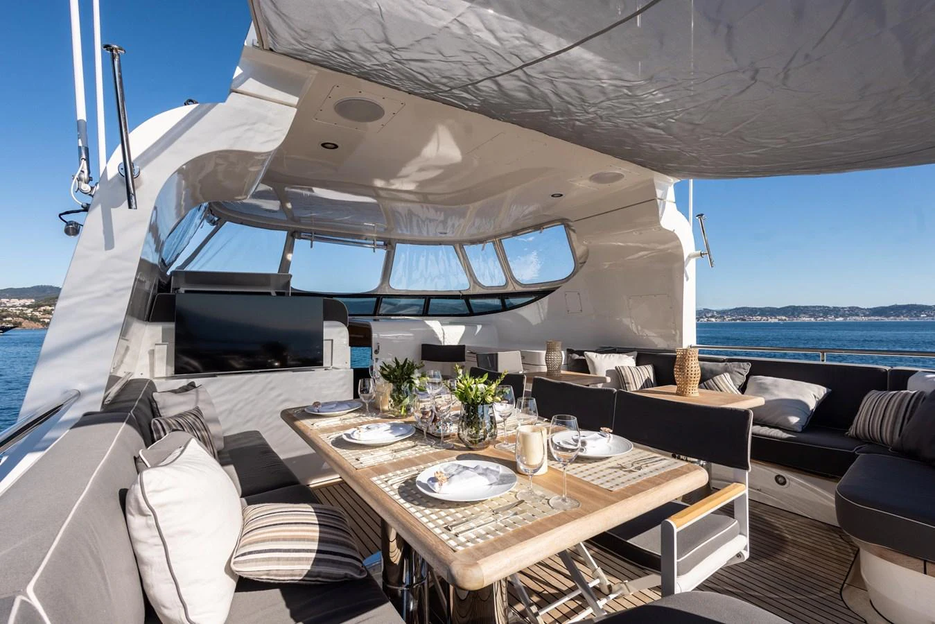 a boat with a table and chairs aboard ARCHIPELAGO Yacht for Sale