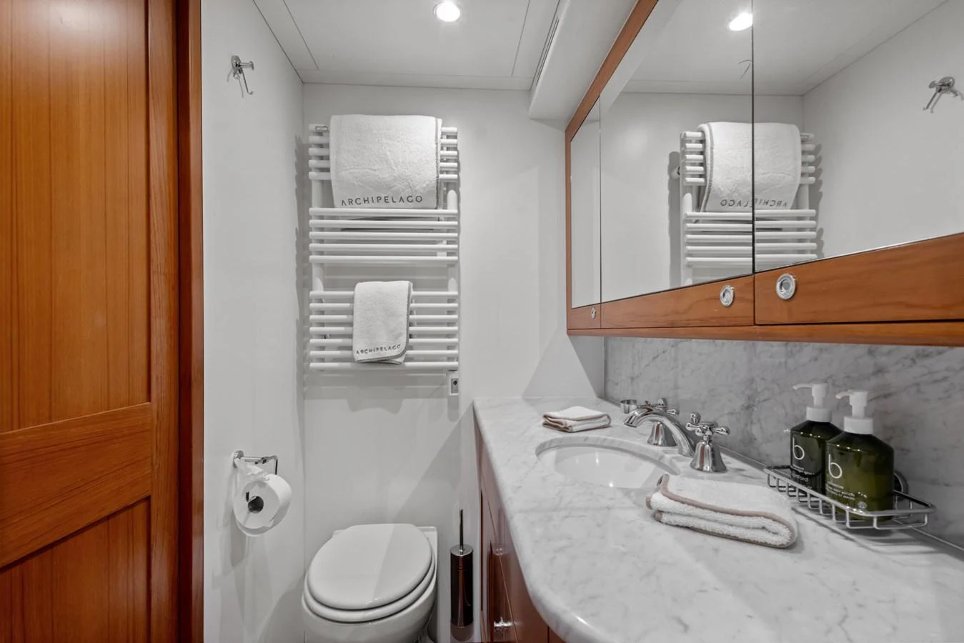 a bathroom with a sink and a mirror aboard ARCHIPELAGO Yacht for Sale