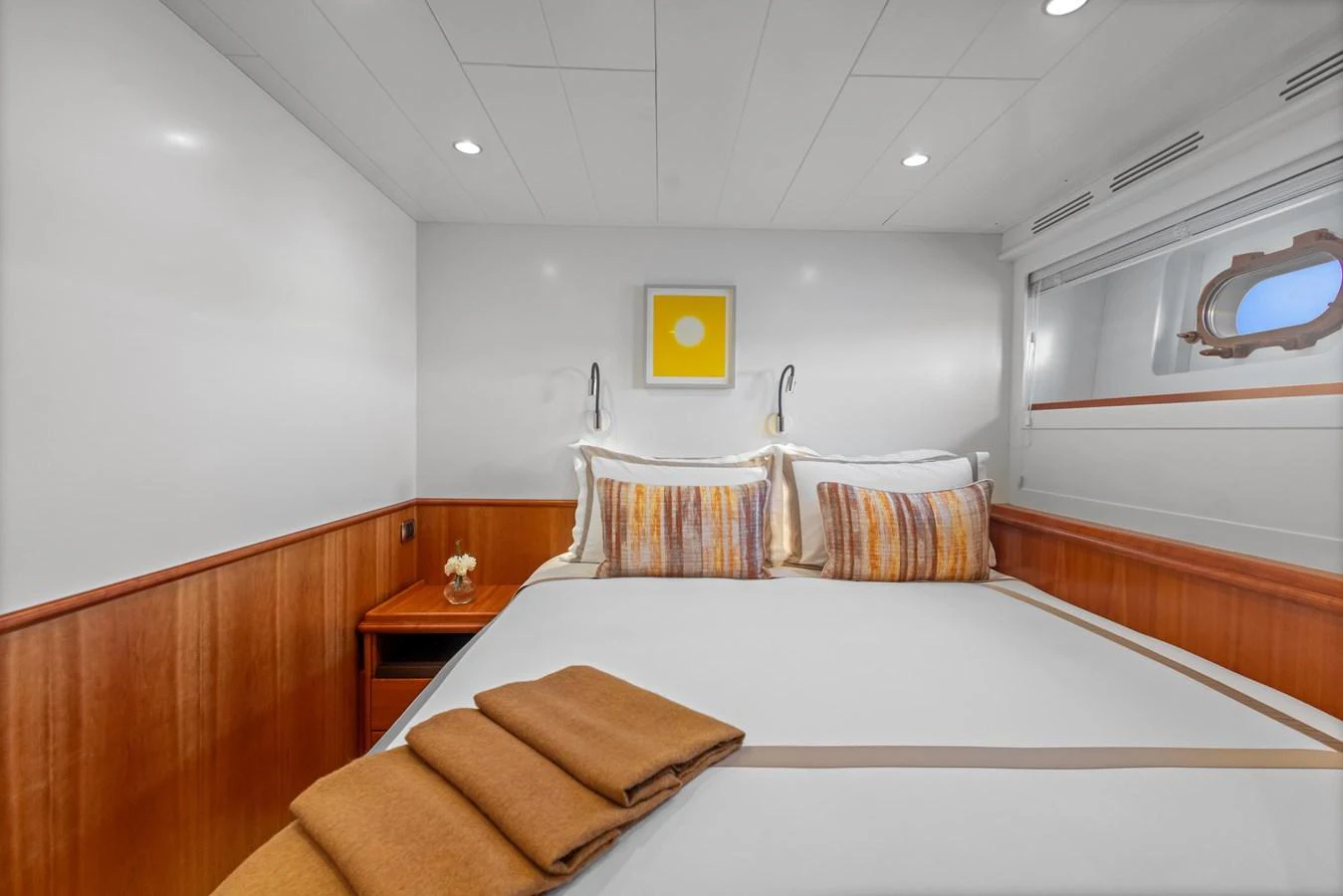a room with a bed and a desk aboard ARCHIPELAGO Yacht for Sale
