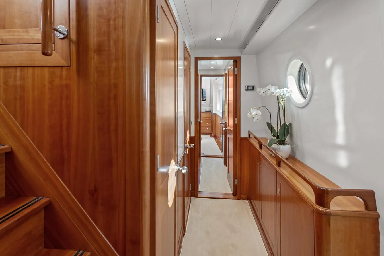 a hallway with wood cabinets aboard ARCHIPELAGO Yacht for Sale