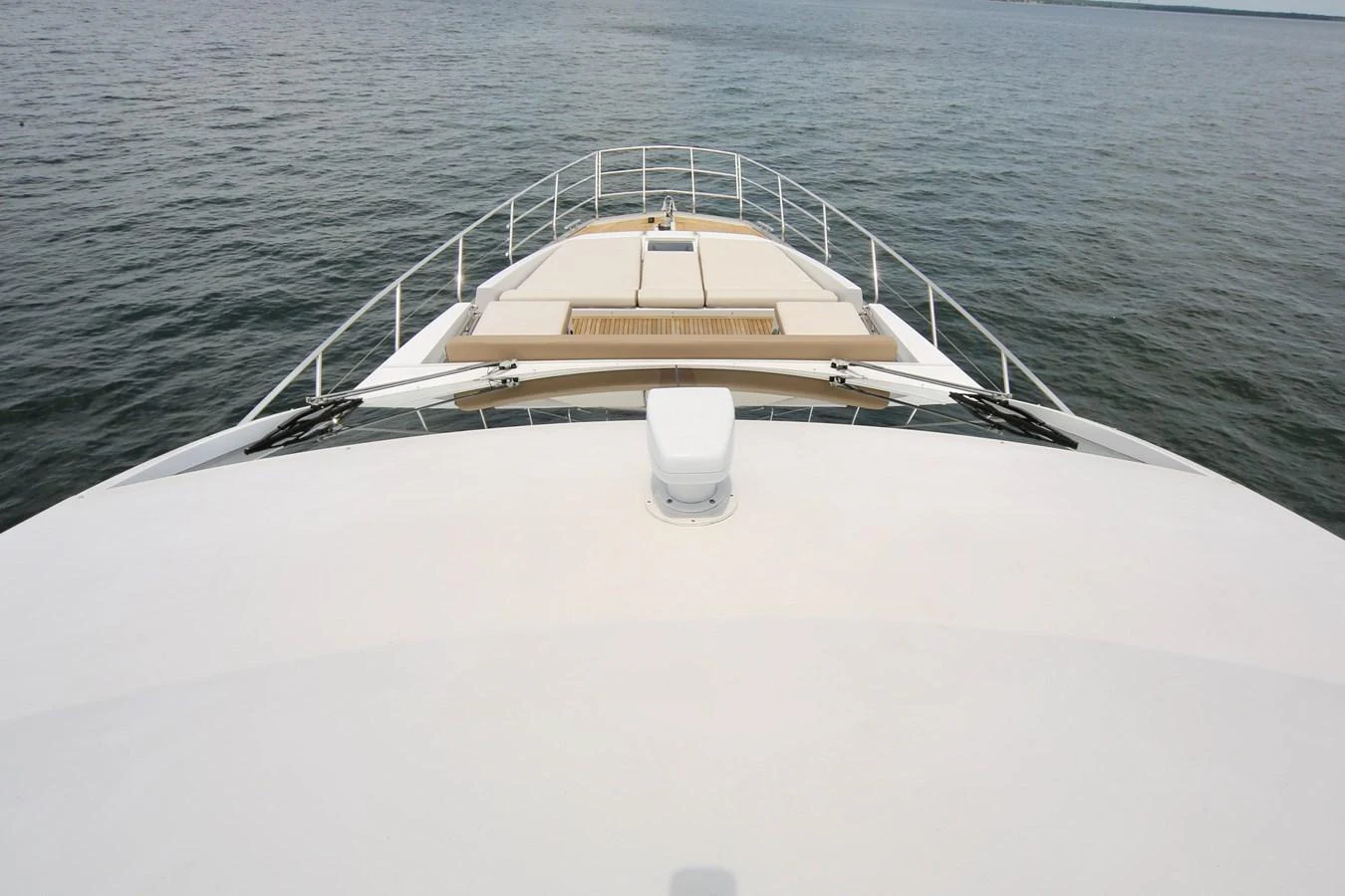 The yacht's foredeck features spacious sun pads for relaxation while cruising. aboard KIKI Yacht for Sale