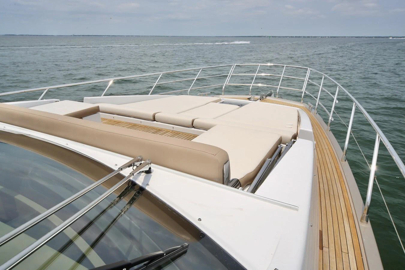 The yacht features a spacious sunbathing area on the foredeck with comfortable lounge cushions. aboard KIKI Yacht for Sale