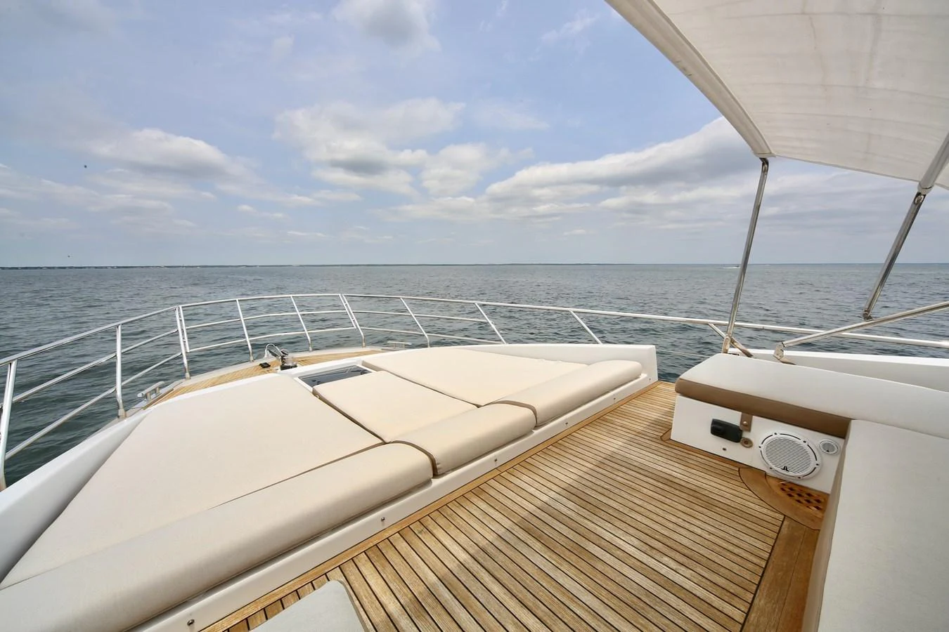 The sundeck offers a spacious and inviting area for relaxation with panoramic ocean views. aboard KIKI Yacht for Sale