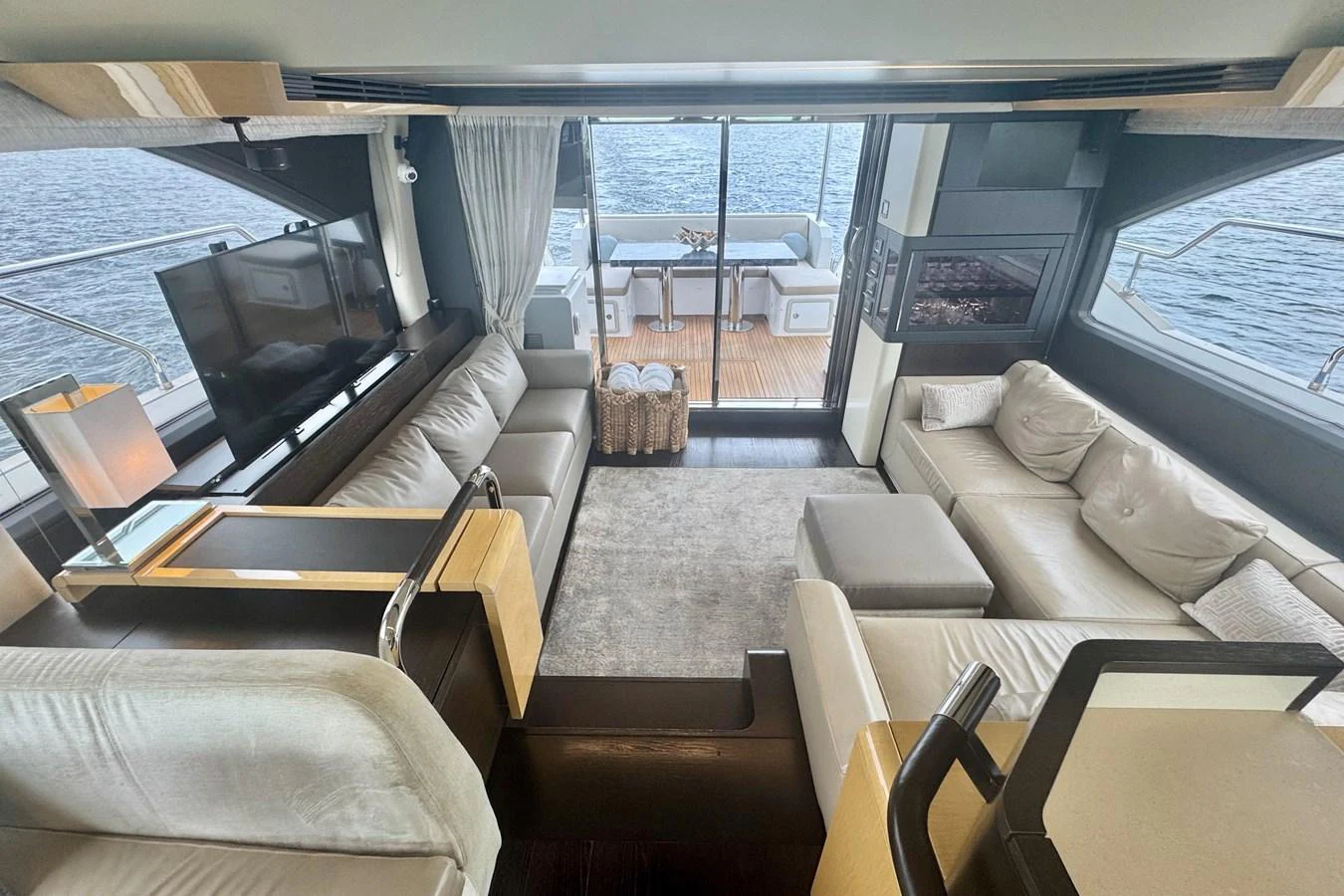 The yacht's salon offers a spacious and luxurious seating area with panoramic views of the water. aboard KIKI Yacht for Sale