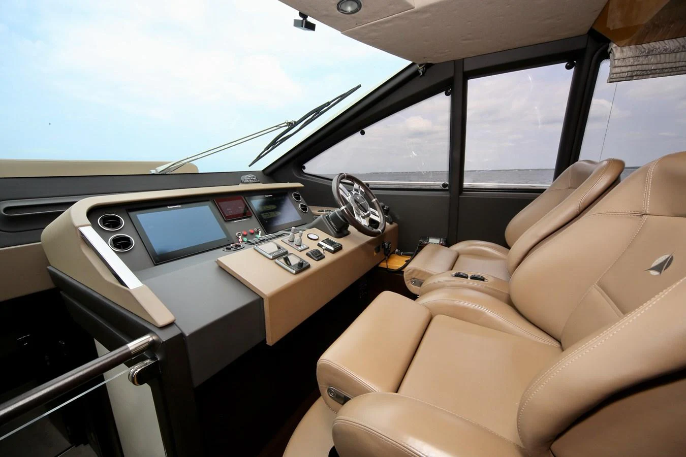 The helm station features luxurious leather seating and state-of-the-art navigation equipment. aboard KIKI Yacht for Sale