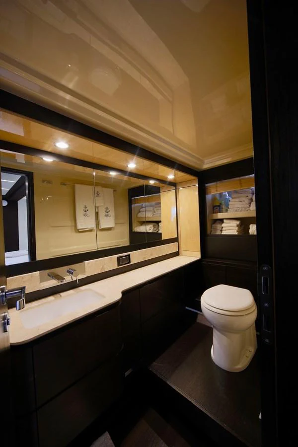 The yacht's bathroom features modern fixtures and ample storage space, creating a luxurious and functional environment. aboard KIKI Yacht for Sale