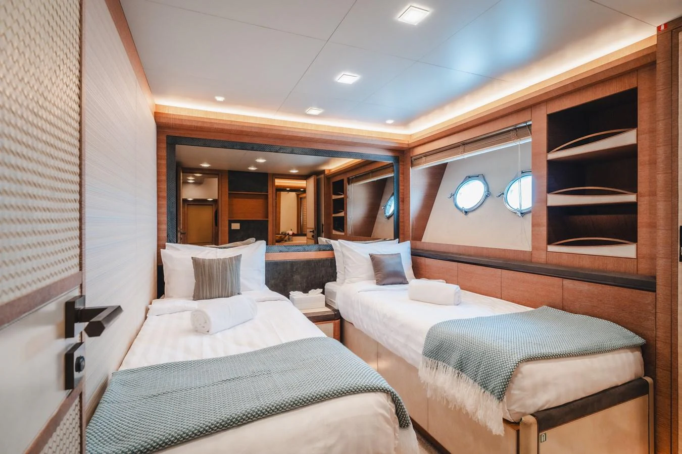 a room with two beds aboard MOANA Yacht for Sale