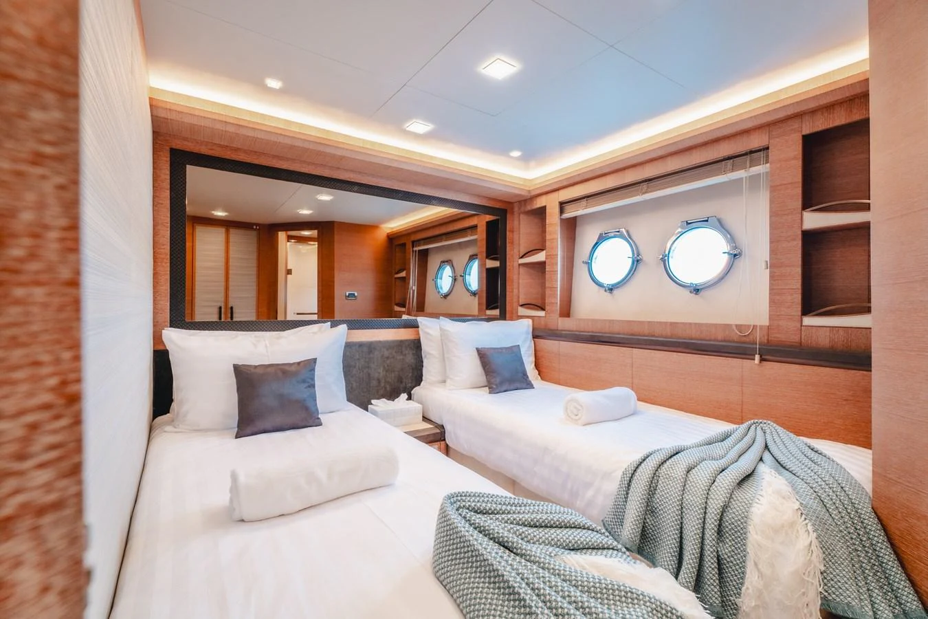 a room with two beds aboard MOANA Yacht for Sale