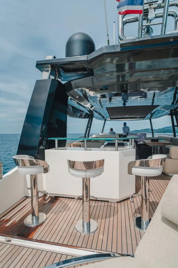 a boat with a helmet on the deck aboard MOANA Yacht for Sale