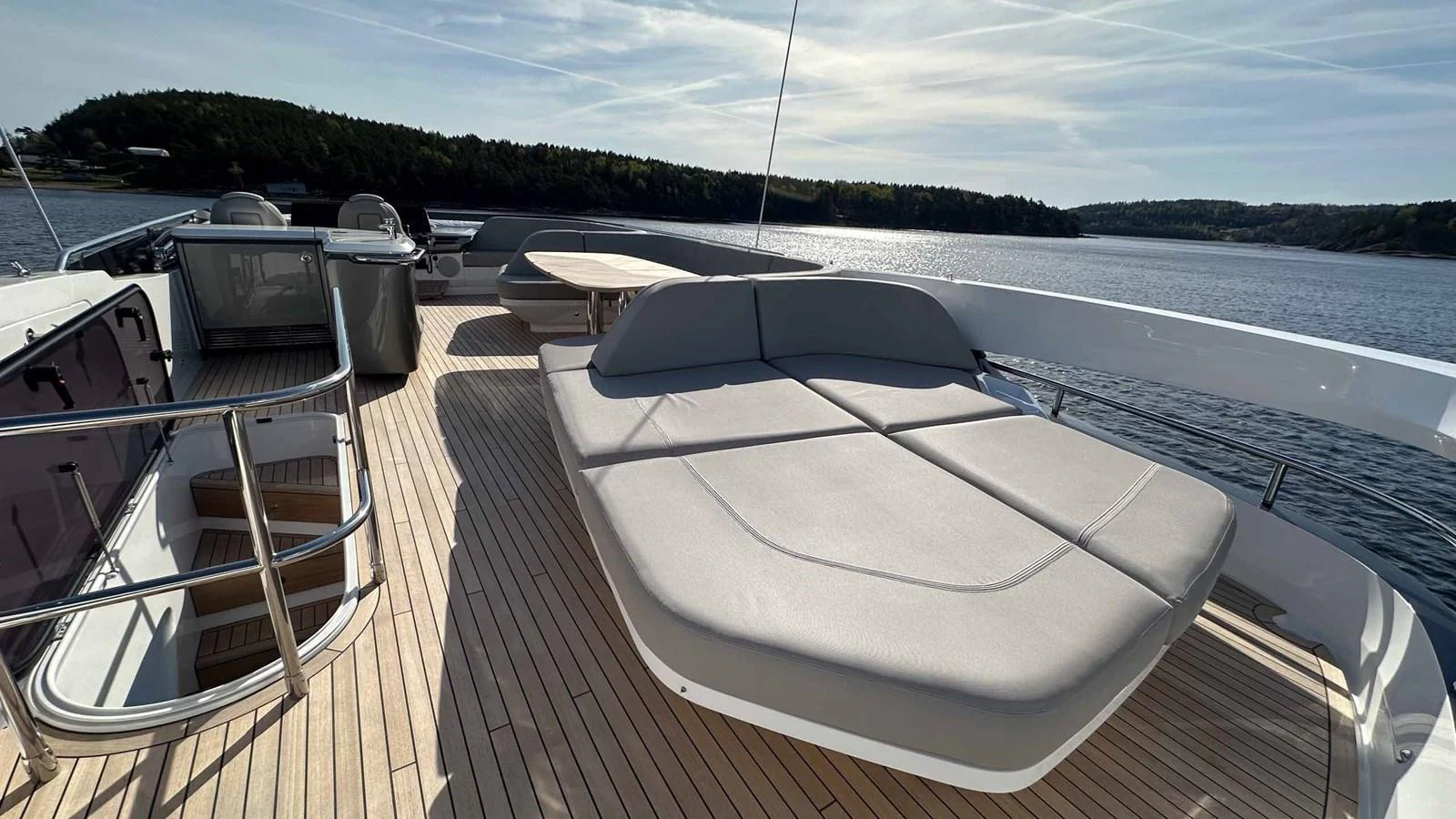 The sundeck offers a spacious lounging area with stunning views of the surrounding waters. aboard PRINCESS F65 Yacht for Sale