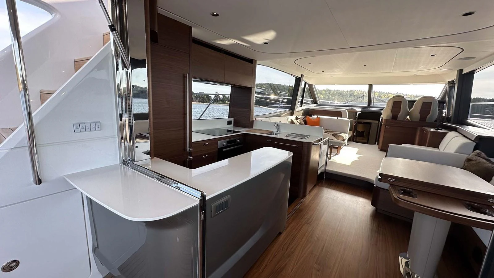 The yacht's salon features a modern and spacious design with ample natural light and luxurious furnishings. aboard PRINCESS F65 Yacht for Sale