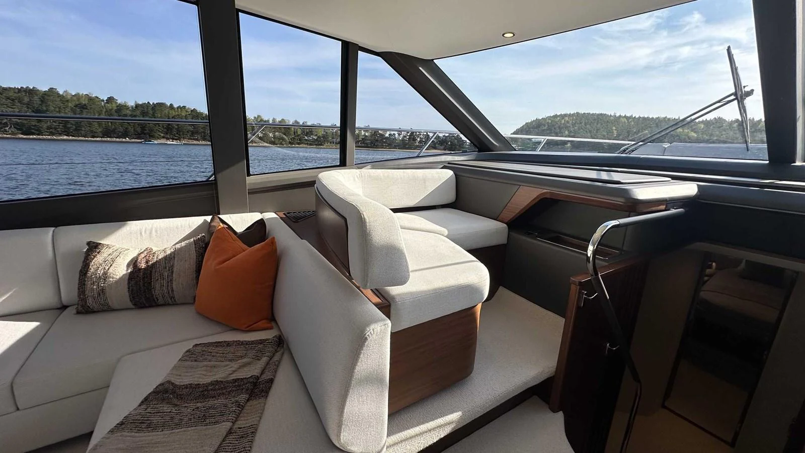 The salon offers a comfortable seating area with panoramic views of the surrounding waters. aboard PRINCESS F65 Yacht for Sale