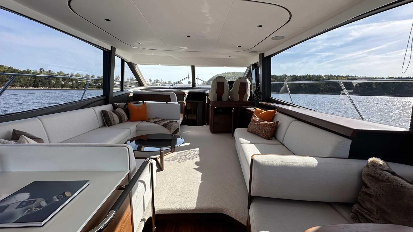 The salon offers a spacious and luxurious seating area with panoramic views of the surrounding waters. aboard PRINCESS F65 Yacht for Sale