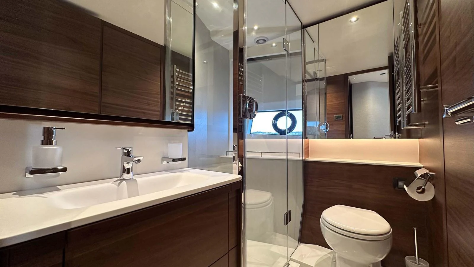 The yacht's bathroom features modern fixtures and a sleek design. aboard PRINCESS F65 Yacht for Sale