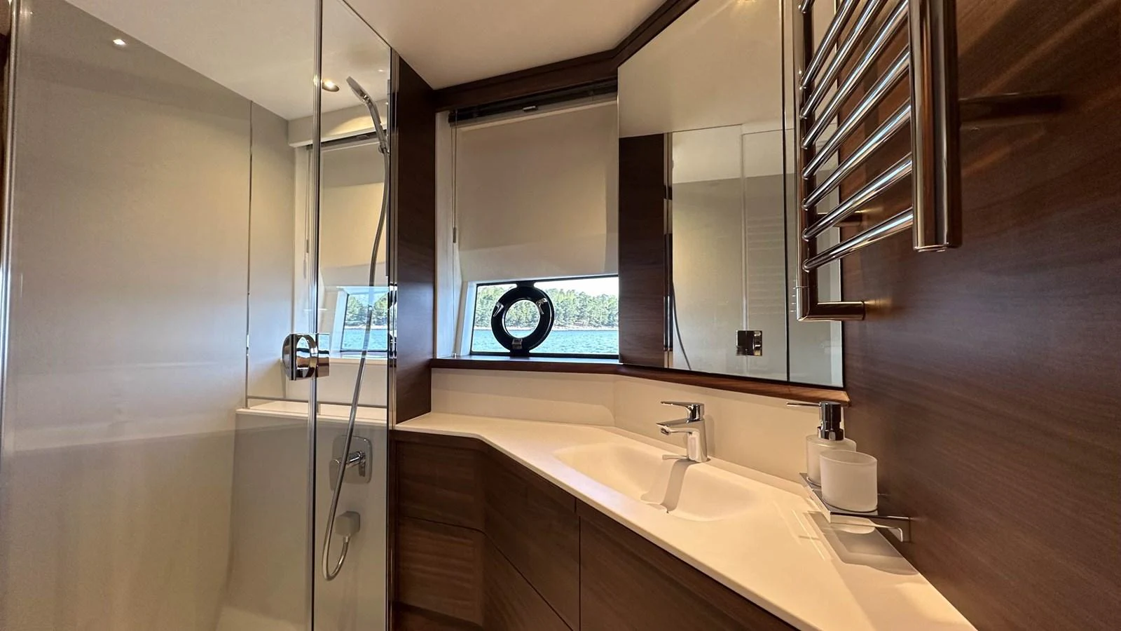 The yacht's bathroom features modern fixtures and a sleek design with ample natural light. aboard PRINCESS F65 Yacht for Sale