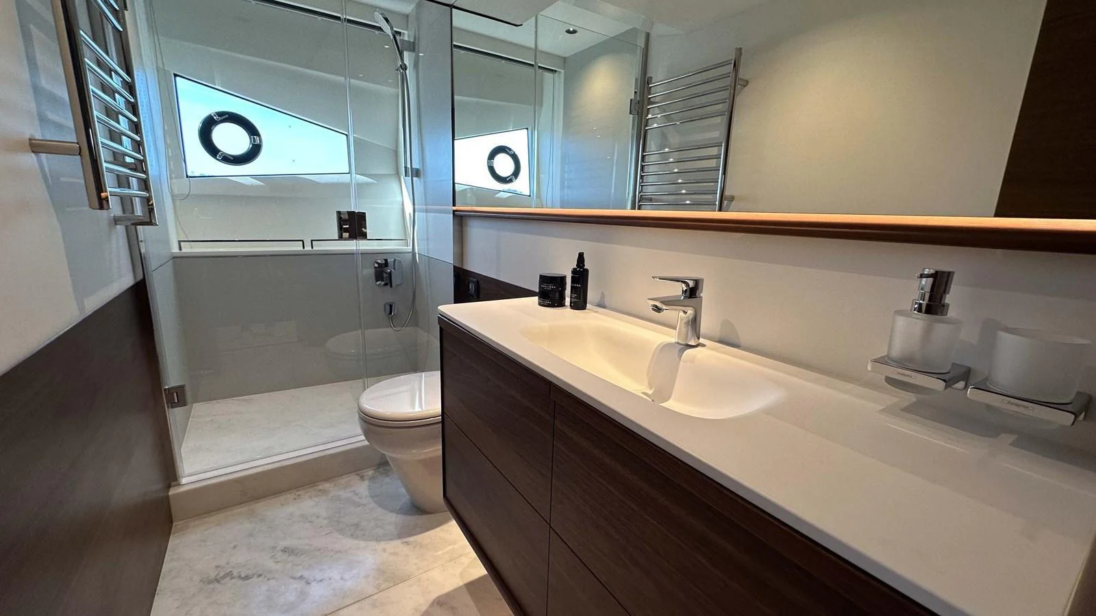 The yacht's bathroom features modern fixtures and a sleek design. aboard PRINCESS F65 Yacht for Sale