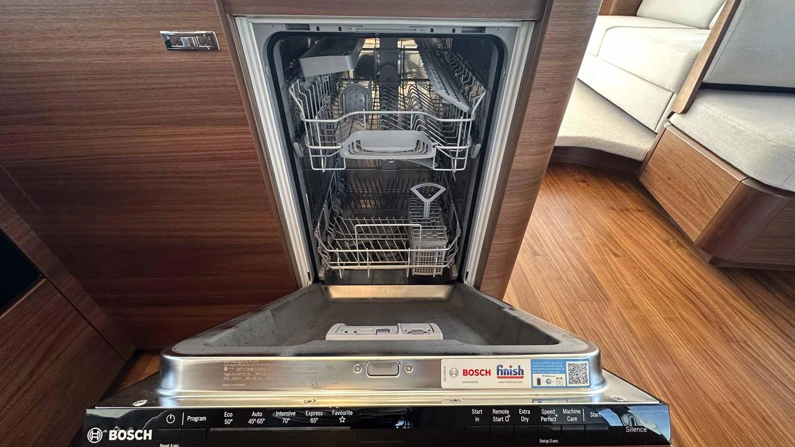 The image showcases a modern dishwasher in the yacht's galley, highlighting its functionality and sleek design. aboard PRINCESS F65 Yacht for Sale