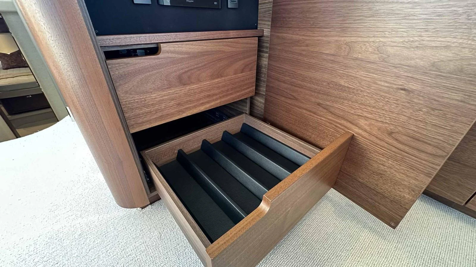 The image showcases a detailed view of wooden drawers with a sleek, modern design. aboard PRINCESS F65 Yacht for Sale