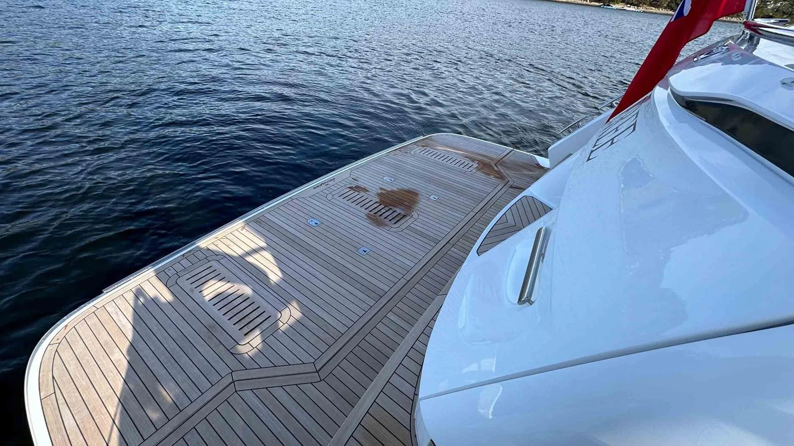 The yacht's swim platform offers easy access to the water and features elegant teak decking. aboard PRINCESS F65 Yacht for Sale