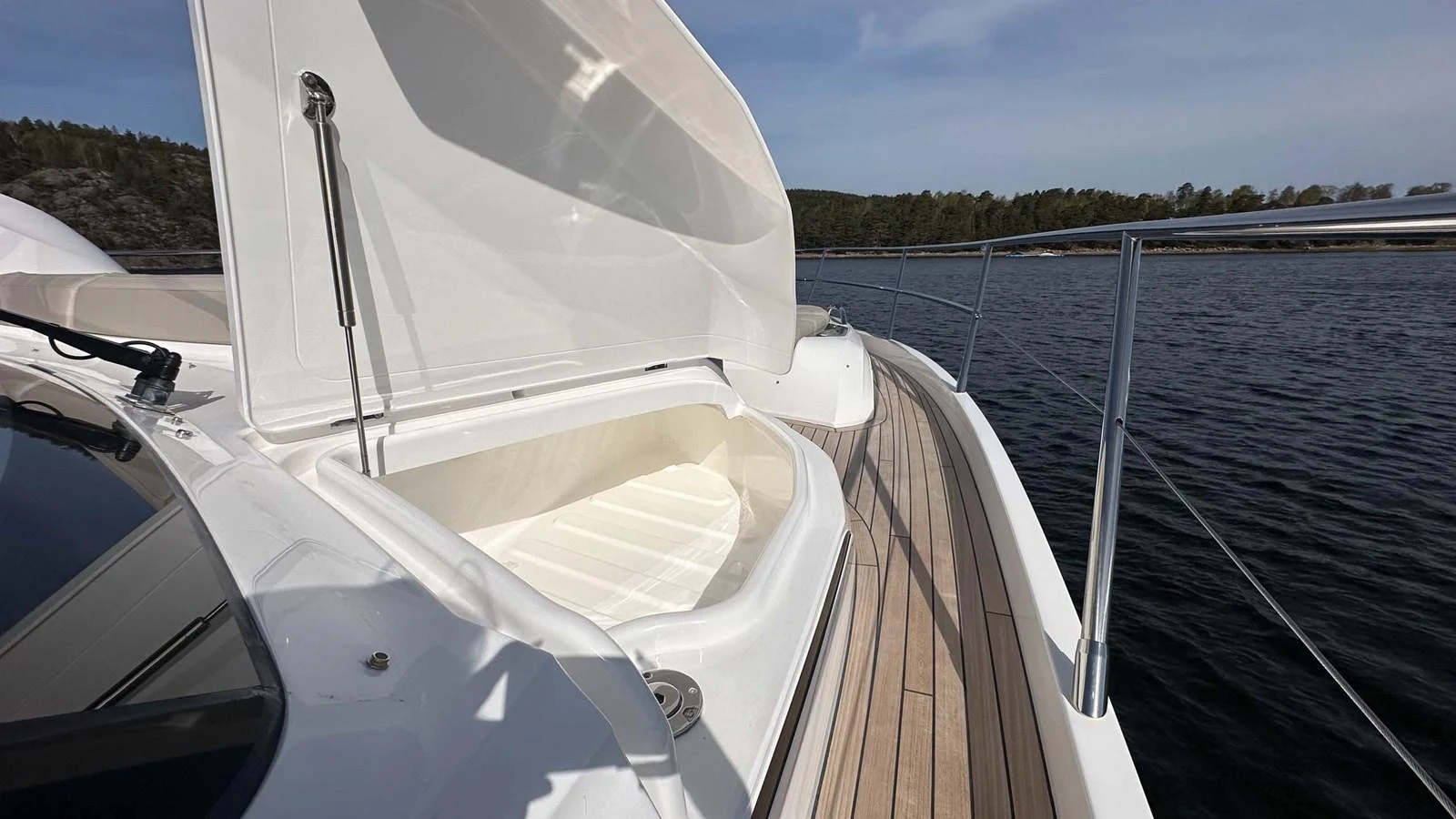The foredeck features a spacious storage compartment with a sleek, modern design. aboard PRINCESS F65 Yacht for Sale