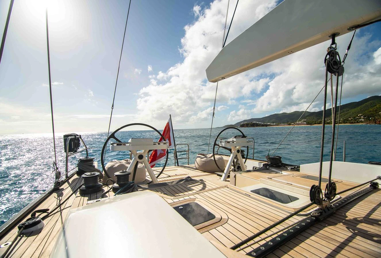 The yacht's deck offers a spacious and elegant area for sailing and relaxation with stunning ocean views. aboard BLACK PEARL II Yacht for Sale