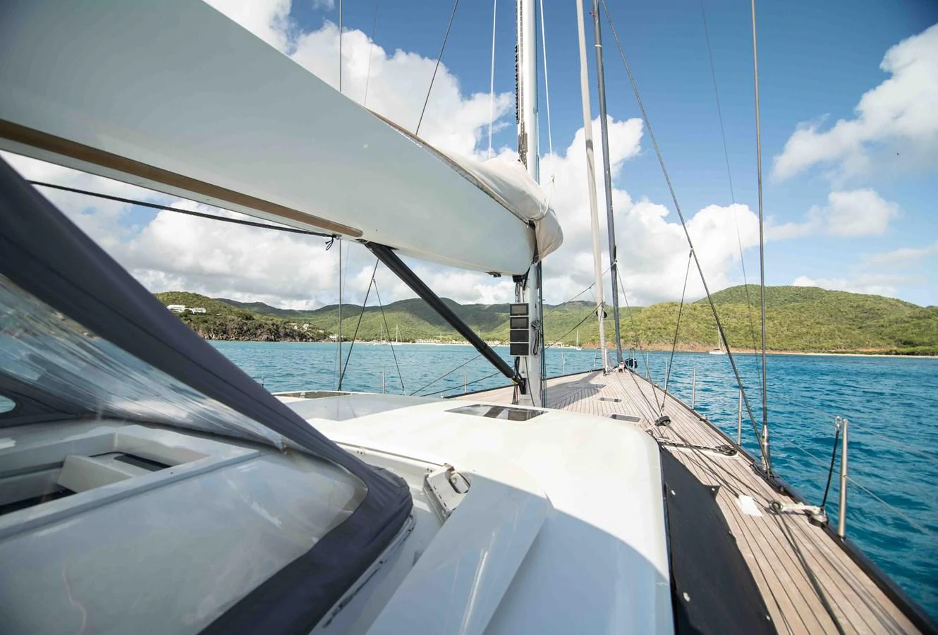 The yacht's deck offers a stunning view of the surrounding waters and distant shoreline. aboard BLACK PEARL II Yacht for Sale