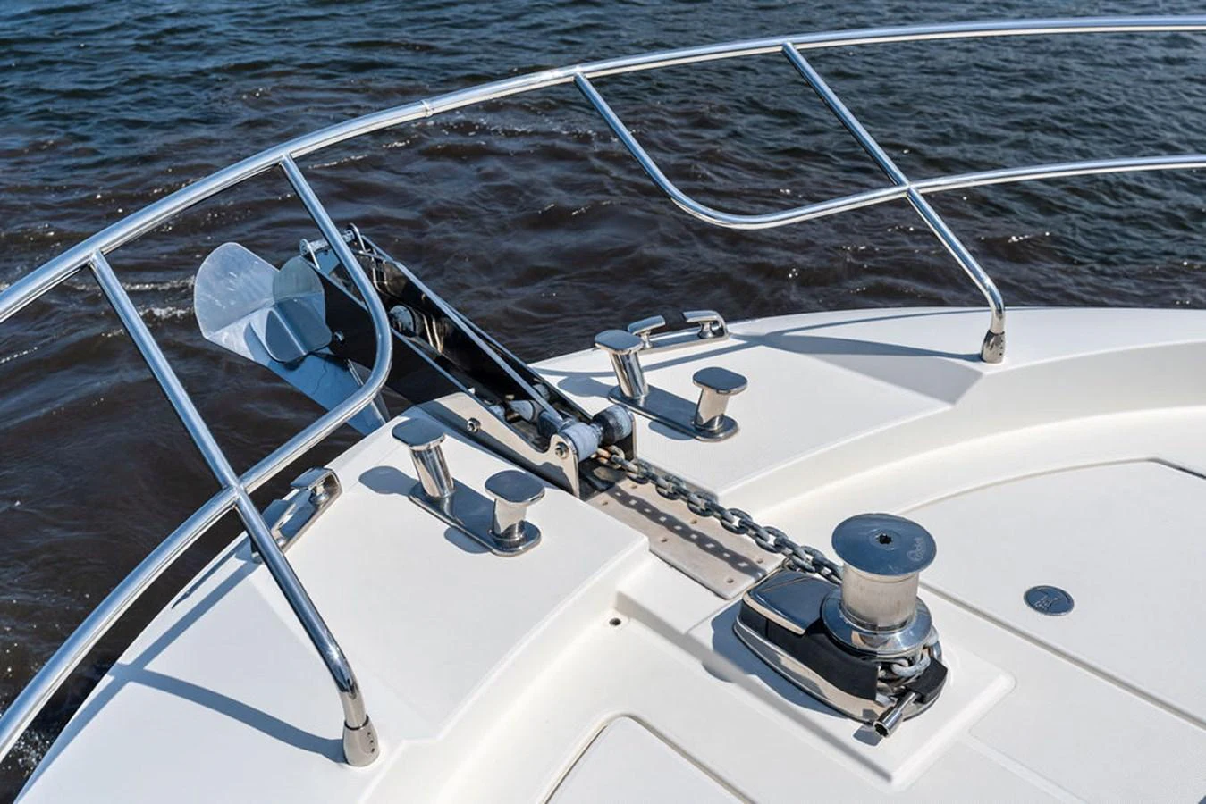 The image showcases the anchor and chain mechanism on the bow of the yacht. aboard JOVE Yacht for Sale