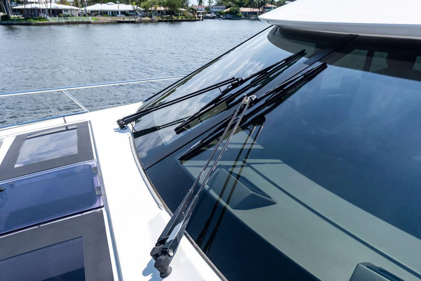 A close-up view of the yacht's windshield and wipers, showcasing the sleek design and attention to detail. aboard JOVE Yacht for Sale