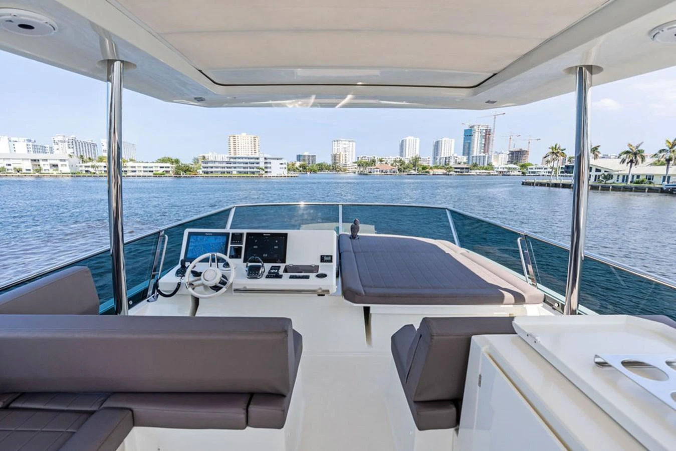 The yacht's flybridge offers a spacious and comfortable area with modern navigation equipment and panoramic views. aboard JOVE Yacht for Sale