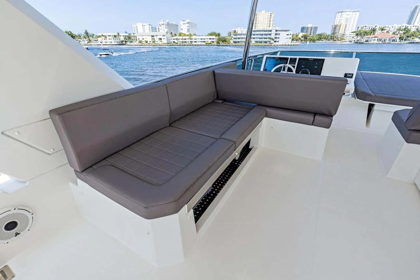 The flybridge features comfortable seating with a scenic view of the water. aboard JOVE Yacht for Sale