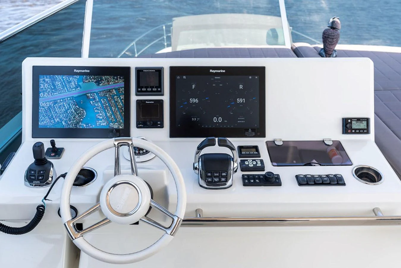 The helm station features advanced navigation equipment and a sleek, modern design. aboard JOVE Yacht for Sale