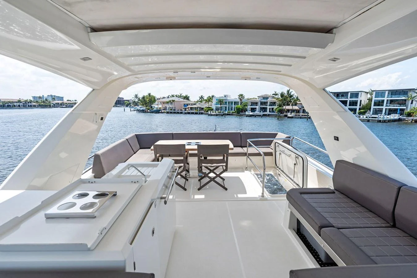 The flybridge offers a spacious and luxurious outdoor area with comfortable seating and stunning views. aboard JOVE Yacht for Sale