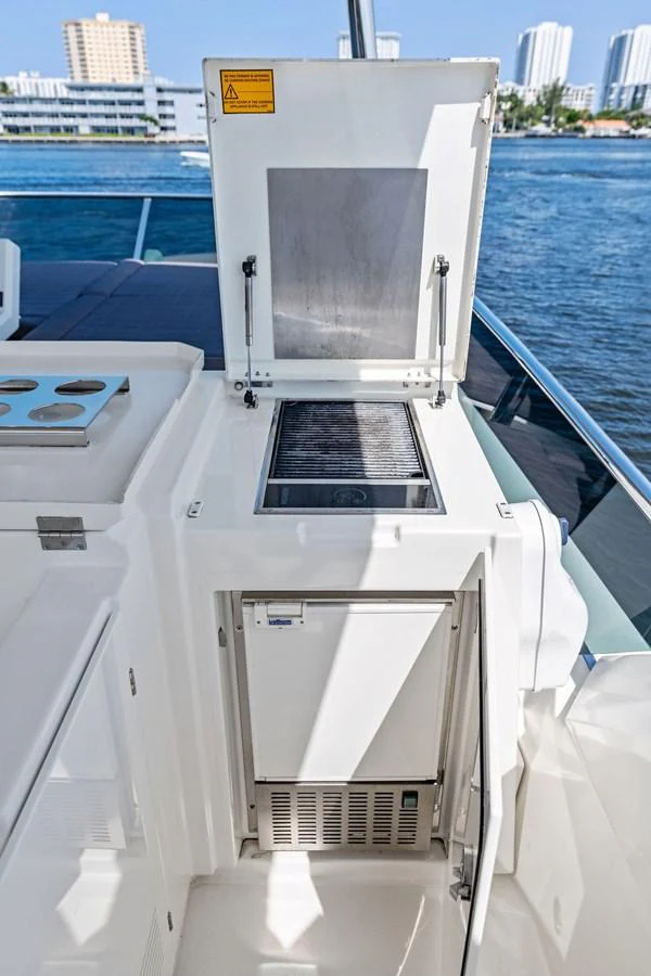 A sleek built-in grill on the yacht's deck offers a convenient outdoor cooking option. aboard JOVE Yacht for Sale
